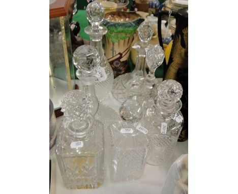 Crystal decanters and stoppers and a ships decanter.