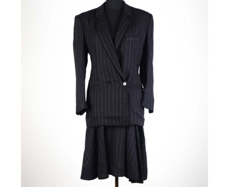 This vintage two-piece skirt suit by Luciano Soprani showcases refined Italian craftsmanship with modern flair. Made in Italy