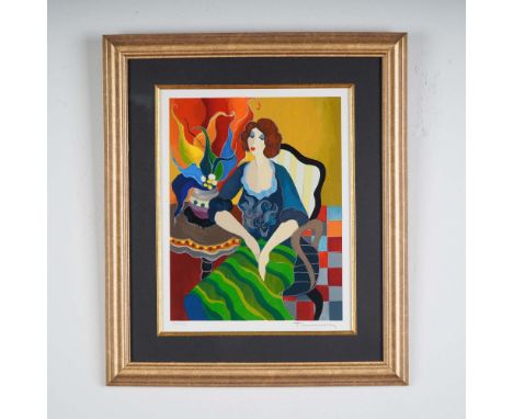 This limited edition serigraph titled Day Dreaming #1 by Itzchak Tarkay depicts a stylized woman seated in a richly colored i
