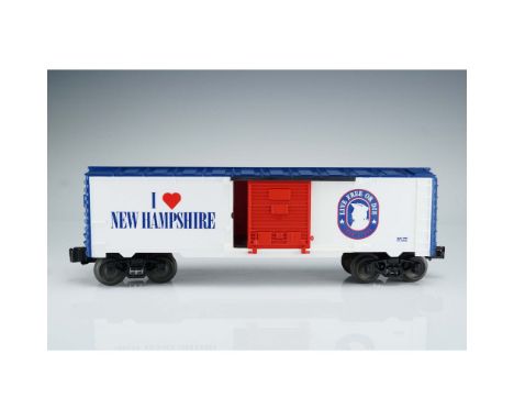 This Lionel O Gauge boxcar features patriotic styling with the phrase "I Love NEW HAMPSHIRE" on one side and the state motto 