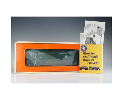 This Lionel Railway Express Agency 6267 boxcar features a deep green body with white stenciling, denoting it as a refrigerato
