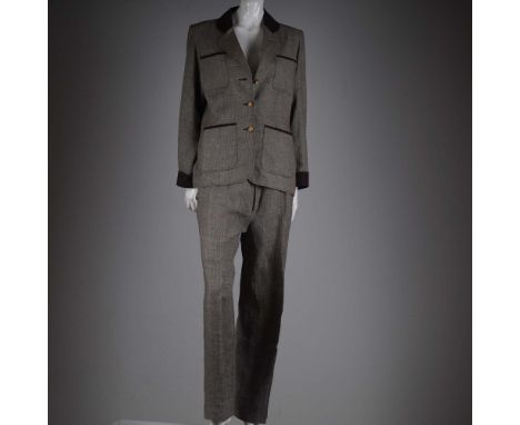 A timeless and sharply tailored wool pantsuit by Yves Saint Laurent Rive Gauche, made in France and marked size 40 (jacket) a