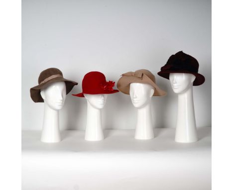 Sophisticated collection of four women's felt hats in a range of neutral and bold tones, each showcasing classic design and m