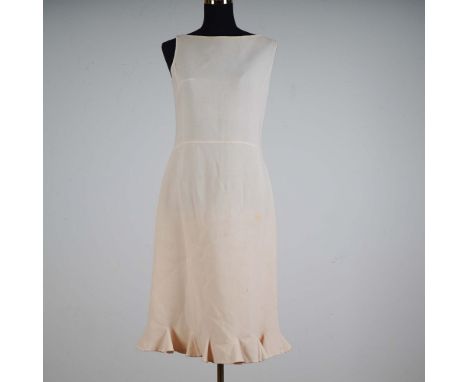 This sleeveless ivory dress by Valentino Boutique exemplifies minimalist elegance with its clean silhouette and refined tailo