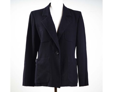 Crafted with signature sophistication, this Yves Saint Laurent Paris women's tailored jacket features a timeless silhouette i