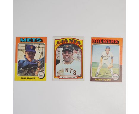 A trio of vintage Topps baseball cards featuring three iconic Hall of Fame players. This lot includes a card of Willie Mays f