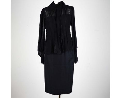 A masterclass in texture and fluidity, this vintage Yves Saint Laurent Rive Gauche 2-piece ensemble offers a striking balance