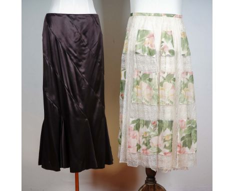 Elegant set of two long skirts by renowned Italian fashion house Valentino, both in size 8. The first is from the Valentino N