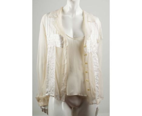This luxurious vintage two-piece set by Valentino Boutique features a sheer cream silk blouse and matching camisole, crafted 