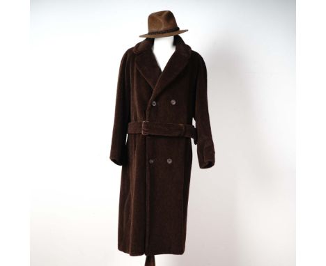 Classic and distinguished Paul Stuart men's overcoat and hat set, crafted in England with luxurious alpaca pile. The full-len