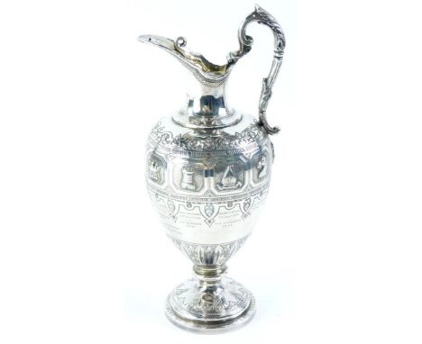 A Victorian silver chess related claret jug trophy, cast with a band of chess pieces, scrolls, etc., engraved 'having won thi