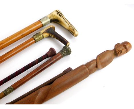 A collection of walking sticks and riding crops, to include an antler handle example, a riding crop with antler handle and ho