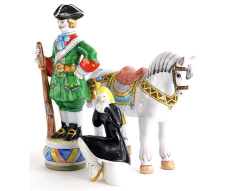 Two late 20thC Russian ceramic figures, modelled in the form of a horse and soldier, and a Russian model of a seated lady wea
