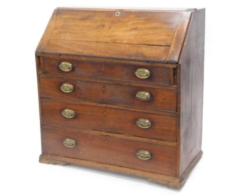 A George III mahogany bureau, the fall enclosing a fitted interior above four graduated drawers, each with pressed oval handl