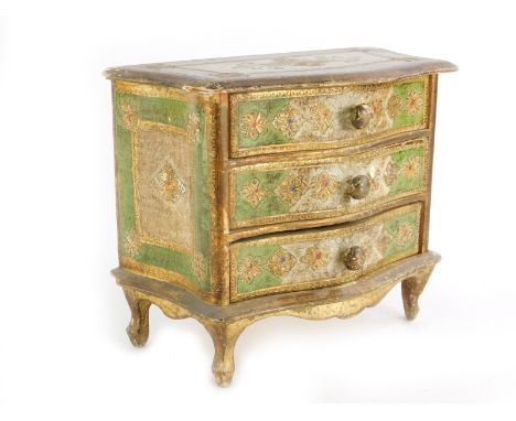 A continental gilt wood miniature Venetian style commode, with three drawers, for jewellery, 19cm high, 23cm wide.