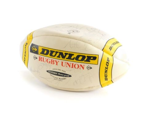 A Dunlop Promotional Rugby Union ball, bearing various signatures of the New Zealand Rugby team.