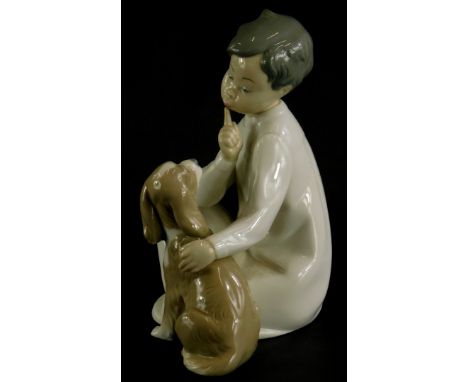 A Lladro porcelain figure group of a young child with a Spaniel puppy, impress number 45226, 19cm high.