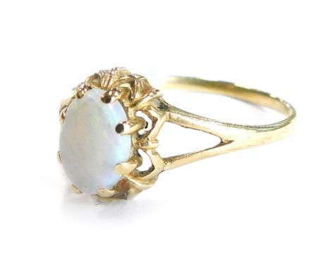 A 9ct gold dress ring, set with oval cut opal, in claw setting with flower design border, ring size N, 1.4g all in.