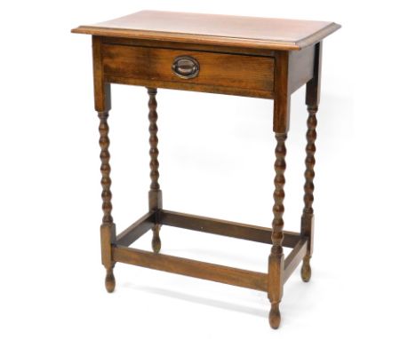 An oak side table, the top with a moulded edge, above a frieze drawer, on bobbin turned legs, 61cm wide.