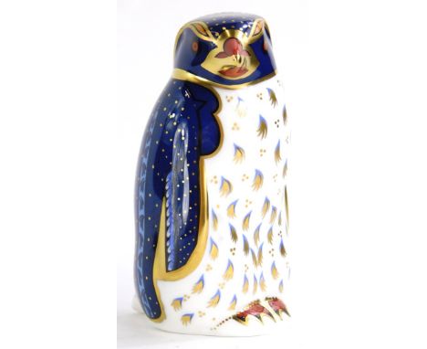 A Royal Derby porcelain paperweight, modelled in the form of a Rock Hopper penguin, gold button to underside. 