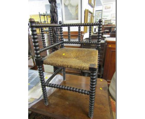 BOBBIN FRAMED CORNER ARMCHAIR, with rush seated panel 