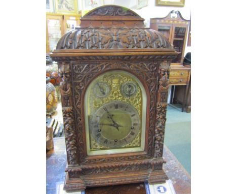 VICTORIAN BRACKET CLOCK, an impressive carved Flemish design oak bracket clock with coiled bar strike movement by Winterhalde