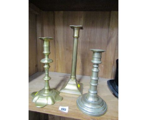 EARLY METALWARE, Georgian brass petal base candlestick, also Georgian column candlestick and one other 