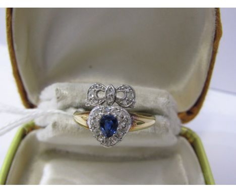 VINTAGE 18ct YELLOW GOLD SAPPHIRE &amp; DIAMOND HEART AND RIBBON RING, principal pear cut sapphire surrounded by accent brill