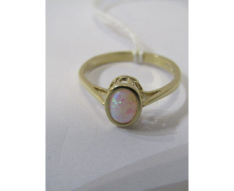 9ct YELLOW GOLD OPAL SOLITAIRE RING, oval cut opal in rub over setting on 9ct yellow gold shank, size N/O 