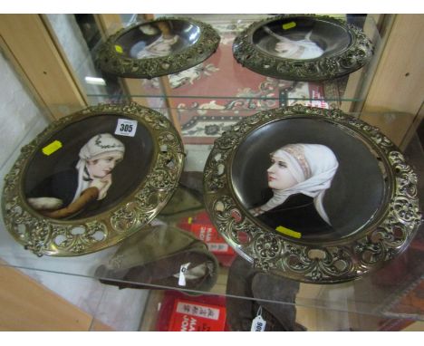 CONTINENTAL PORTRAIT PLAQUES, pair of ornate brass dish frames enclosing enamelled portraits of Young Ladies 