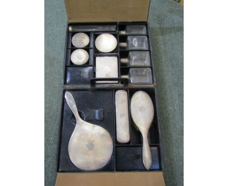 LADIES SILVER VANITY SET, Art Deco ladies leather clad vanity box enclosing 4 silver topped jars with engine turned decoratio