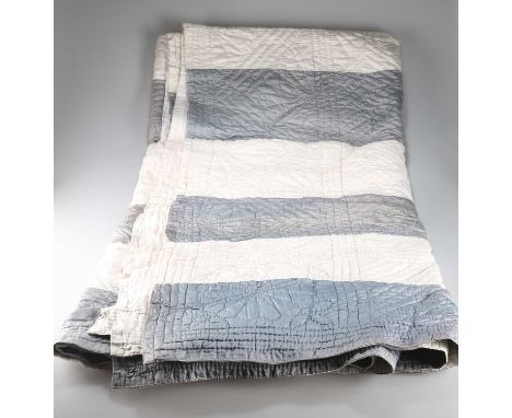 A DURHAM QUILT, EARLY 20TH CENTURY A DURHAM QUILT, EARLY 20TH CENTURY, silver-grey and white panel strips to one side, plain 