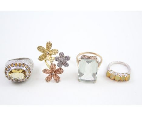 Four silver stone set cocktail rings including diamond and opal (33g) 