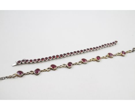 Two silver stone set tennis bracelets including ruby and garnet (37g) 