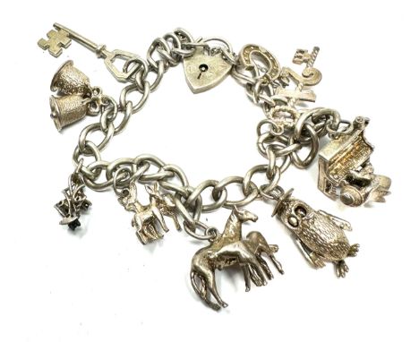 Vintage silver charm bracelet and charms weight 36g 