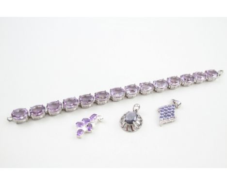 A collection of stone set silver jewellery including an amethyst tennis bracelet (39g) 