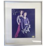 A framed and glazed colour photograph, bearing the signature of Alien: Resurrection actors Sigourney