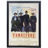 A framed one-sheet poster for Tombstone starring Kurt Russell and Val Kilmer. Bearing the signatures