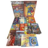 A pair of DC comic book canvas prints, together with a collection of various annuals etc