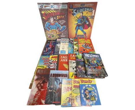 A pair of DC comic book canvas prints, together with a collection of various annuals etc