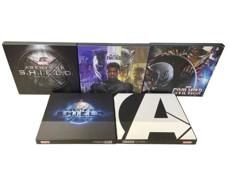 A collection of Marvel special collectors books in slipcases, to include: Agents of SHIELD; Black Panther; Captain America: C