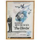 A framed reproduction one sheet poster for Alfred Hitchcock's The Birds, starring Tippi Hedren