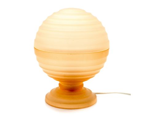 Art Deco pink glass table lamp, frosted and horizontally fluted spherical form, on conical foot, fitted for electricity, 22cm