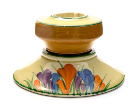 Clarice Cliff for Newport Pottery, a Crocus pattern candlestick, shape number 331, Bizarre marks, 9cm diameter, 5cm high