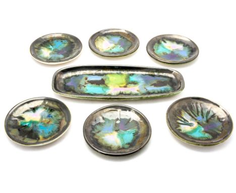 Eric Leaper, a Newlyn Pottery sandwich set including six small plates and long plate, patch work abstract glaze (7)