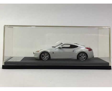 HPI RACING TWO 1:43 SCALE MODELS comprising Nissan Fairlady Z (in blue and white respectively), with a Make Up Co MAT edition