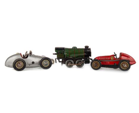 TWO SCHUCO MODEL VEHICLES ALONG WITH A MODEL TRAIN ENGINE the Schuco models of Grand Prix Racer 1070 and another model 1050, 