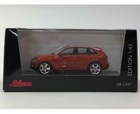 SCHUCO SIXTEEN 1:43 SCALE MODELS all Audi Q5 in metallic red, also a VW Beetle, boxed