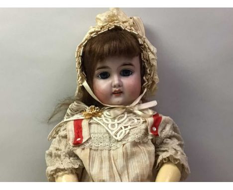 GEBRUDER KUHNLENZ BISQUE HEAD SOCKET DOLL LATE 19TH / EARLY 20TH CENTURY open blue glass eyes, open mouth with four upper tee