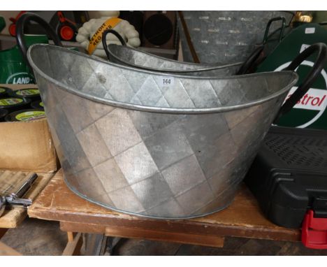 An oval galvanized finished planter 